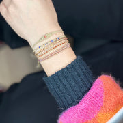 Pulsera Trenza Hecha a Mano en Tonos Cobre, Naranja y Dorado