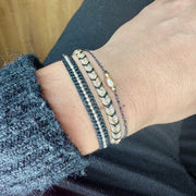 Pulsera Trenza Hecha a Mano en Tonos Negro, Plata y Oro Rosa